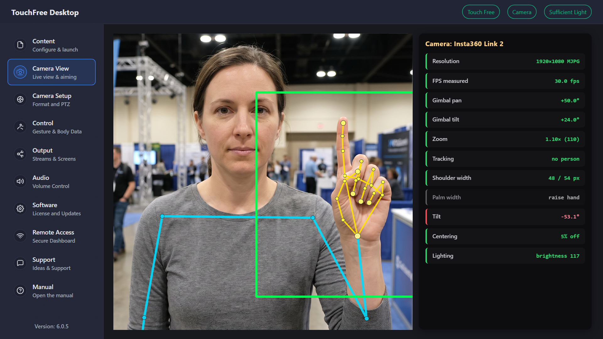 TouchFree Desktop Camera View showing live hand and body tracking beside the camera readouts: resolution, measured frame rate, gimbal pan and tilt, zoom, shoulder width, tilt, centring and lighting